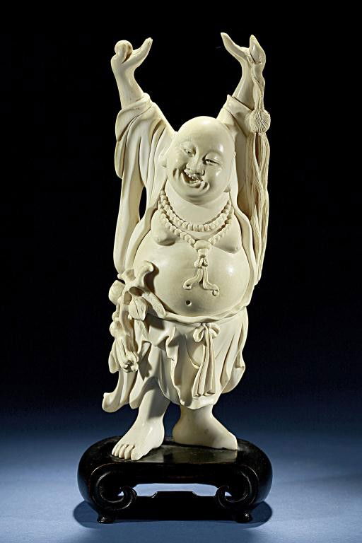 small carved ivory buddha