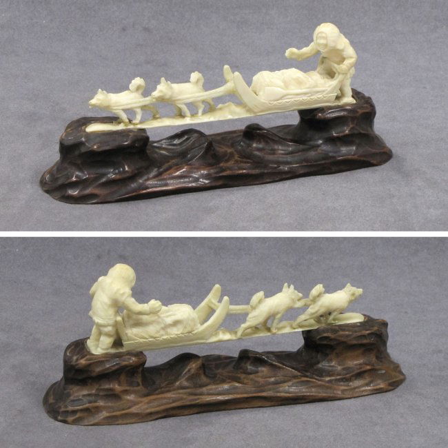 INUIT CARVED WALRUS TUSK DOG SLED TEAM AND DRIVER : Lot 157