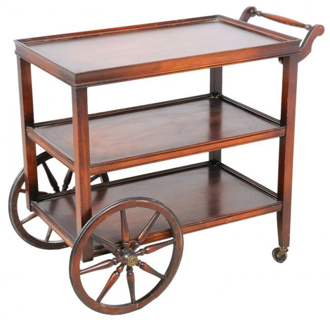 A VINTAGE ROLLING SERVING CART WITH WAGON WHEELS Lot 124