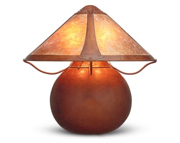 A large Arts & Crafts style copper table lamp