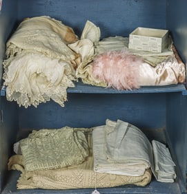 A group of vintage bed and table linens