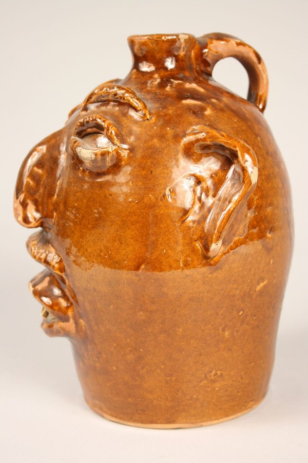200 Brown pottery face jug, North Carolina Lot 200