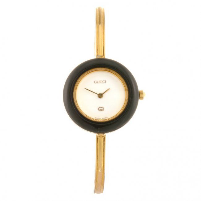 A gold plated quartz lady's Gucci 11/12 bangle watch. : Lot 80