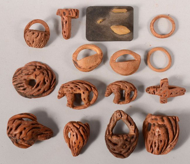 Fifteen Pieces of Carved Peach Pit Folk Art. Shapes inc Lot 663