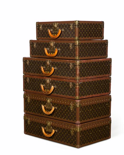 A set of six Louis Vuitton hard sided suitcases