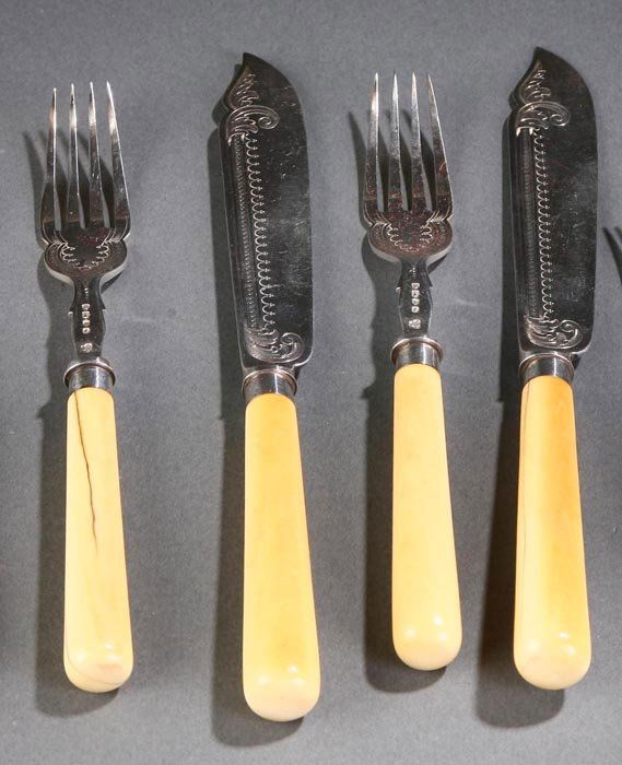 553 VICTORIAN IVORYHANDLED SILVER FLATWARE SET. Lot 553