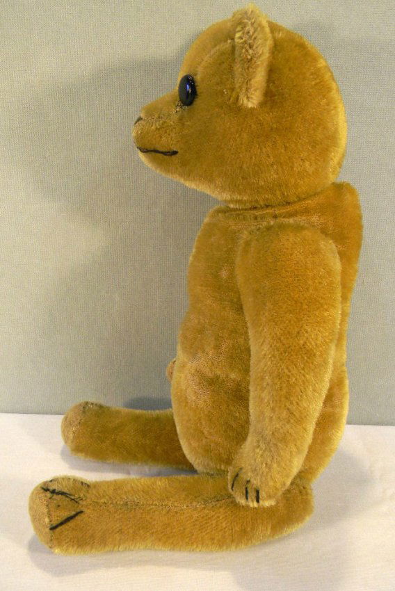 old teddy bear with moving arms and legs