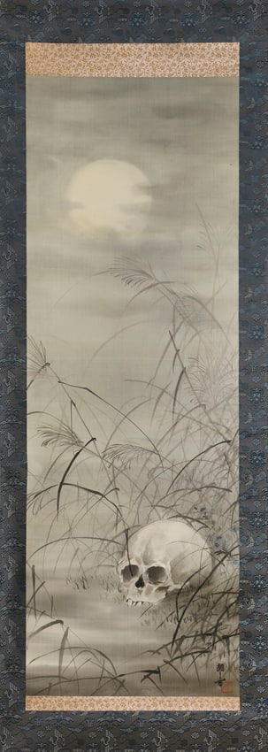 JAPANESE SCROLL PAINTING OF A SKULL AMONGST TALL GRASS