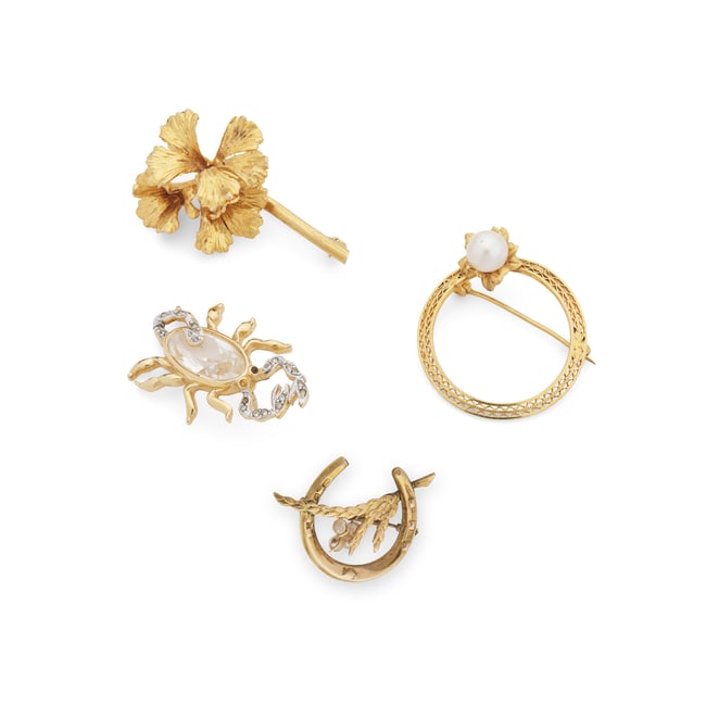 A collection of gem-set brooches